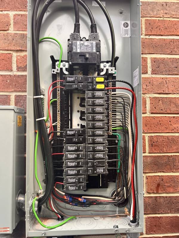 Clean new Eaton panel with neatly organized wiring after replacement